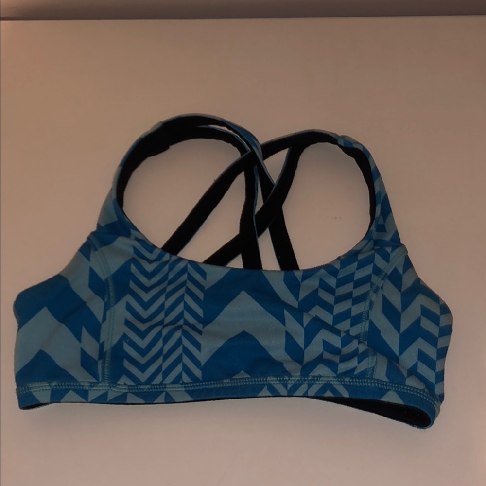 girls blue design and black reversible sports bra